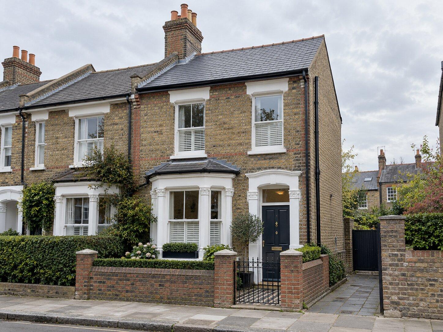 After: the same terrace re-roofed in reclaimed slate with new leadwork